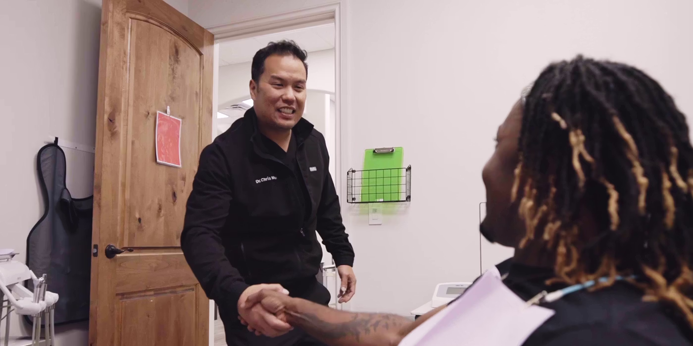 Patient at a dental appointment talks to the best dentist in Pflugerville about treatment options