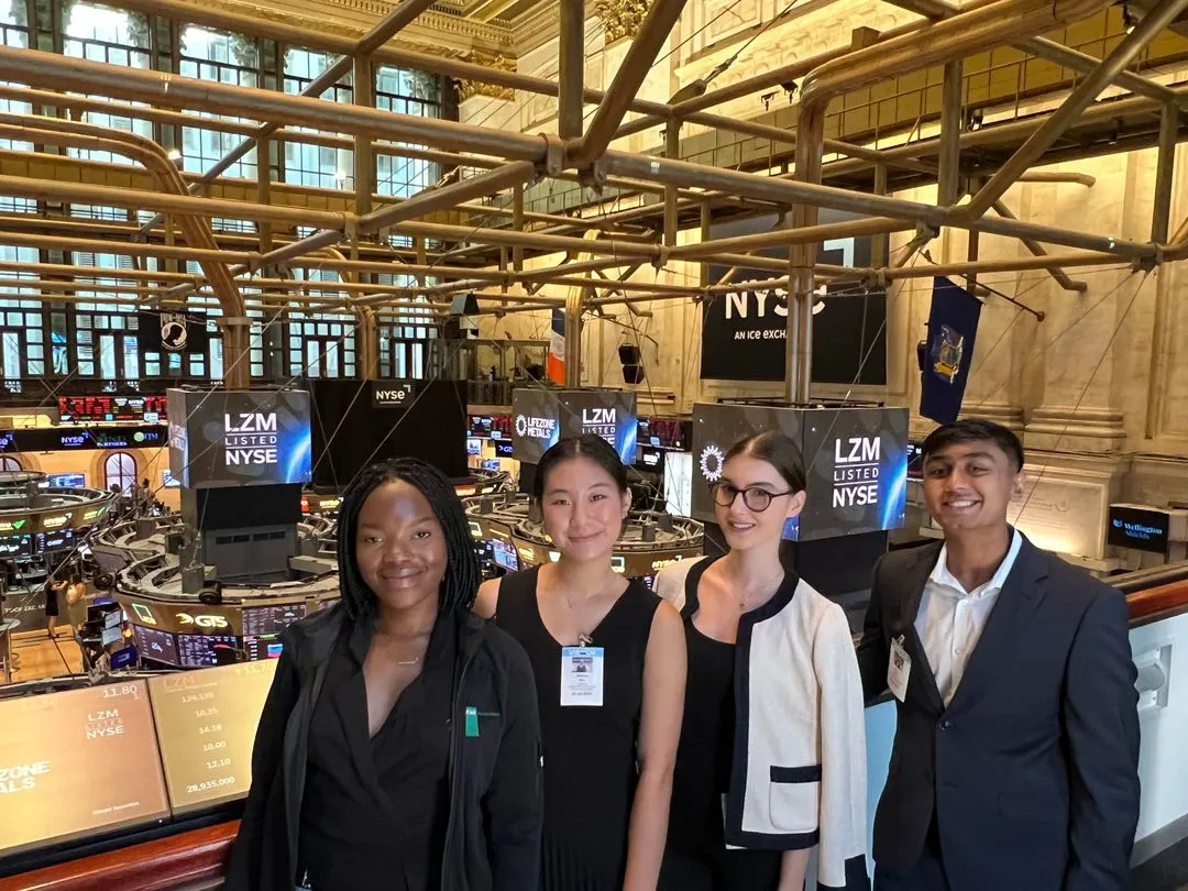Group of interns at stock exchange