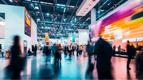 People at a trade show event moving at a fast pace