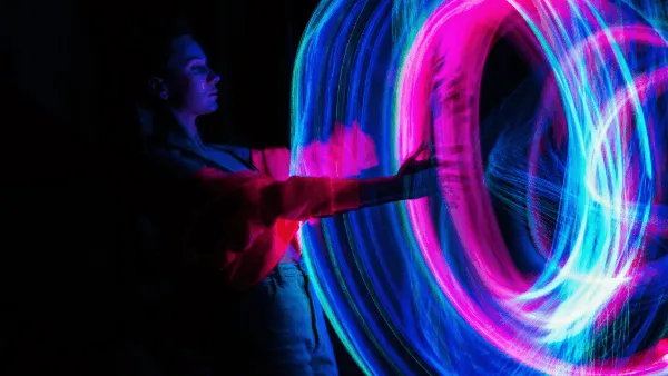 A person pointing at an abstract digital circle