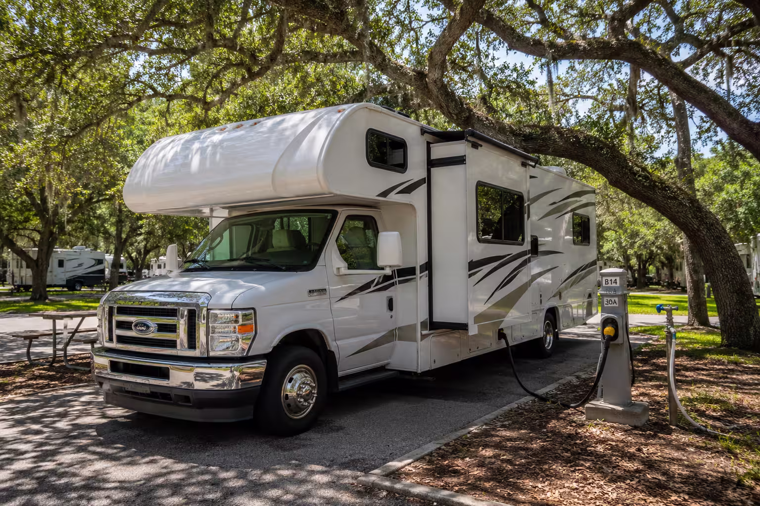 Small motorhome at a shaded Tampa RV park hookup siteSmall motorhome at a shaded Tampa RV park hookup site