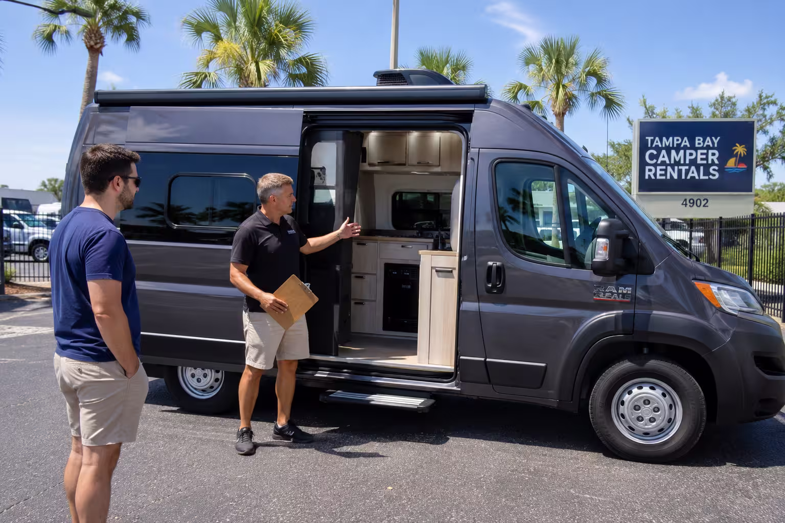 Manager showing a renter a Tampa camper van interior