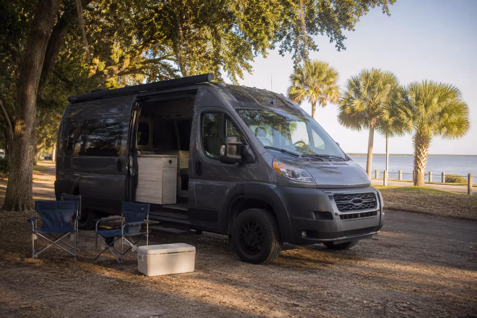 Compact camper rental parked at a Tampa Gulf Coast campsite