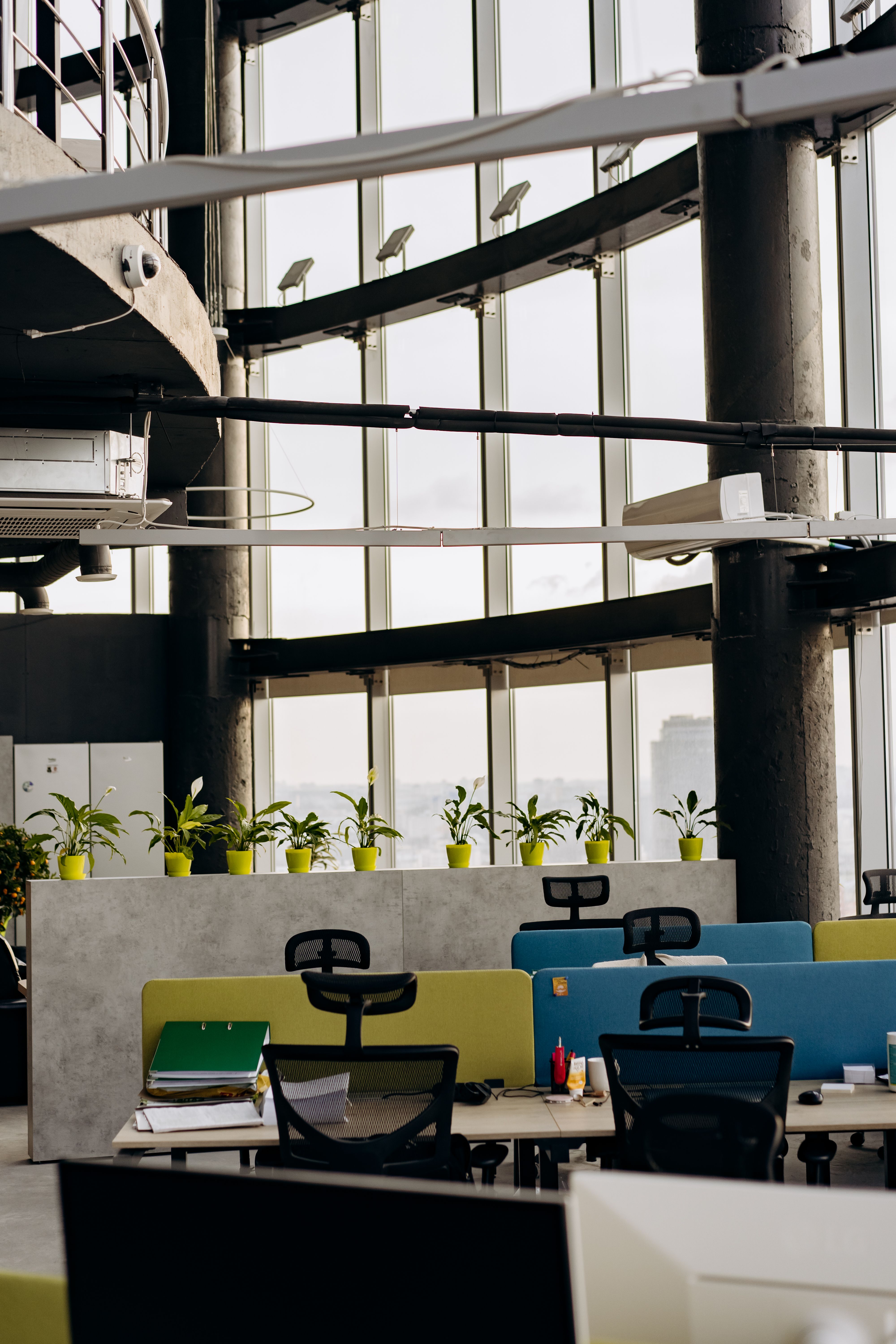 Modern office workspace with desks and computers.