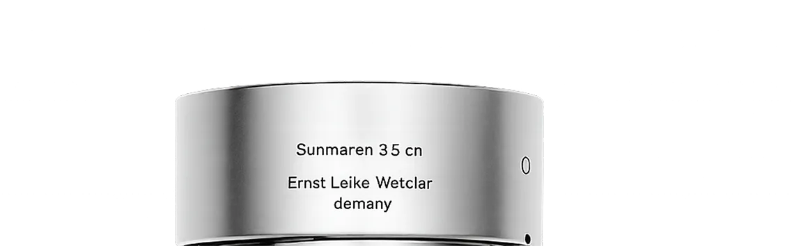 Close-up of a silver metal ring engraved with 'Sunmaren 35 cn Ernst Leike Wetclar demany'.