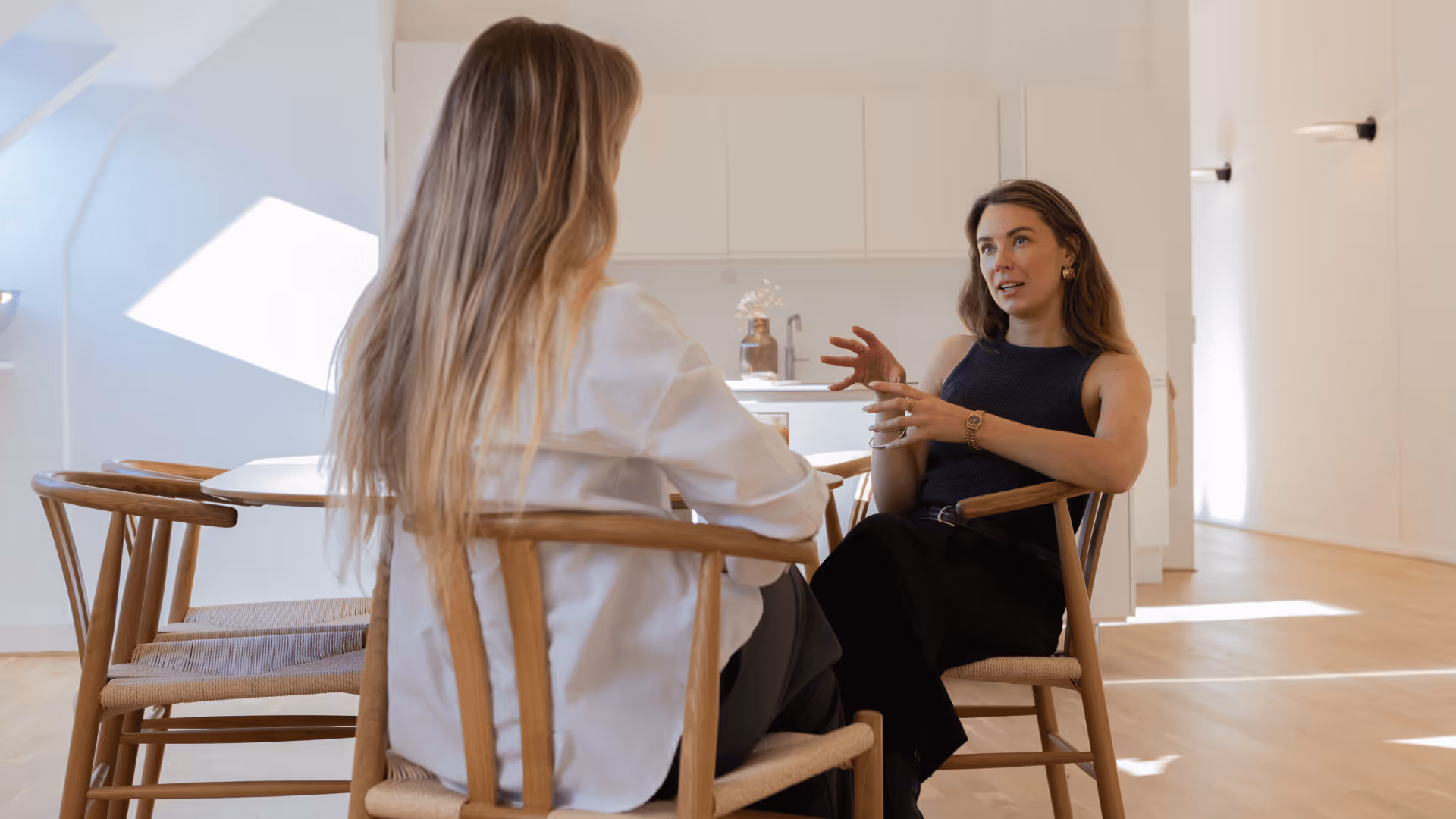 Two female Profound North employees talking