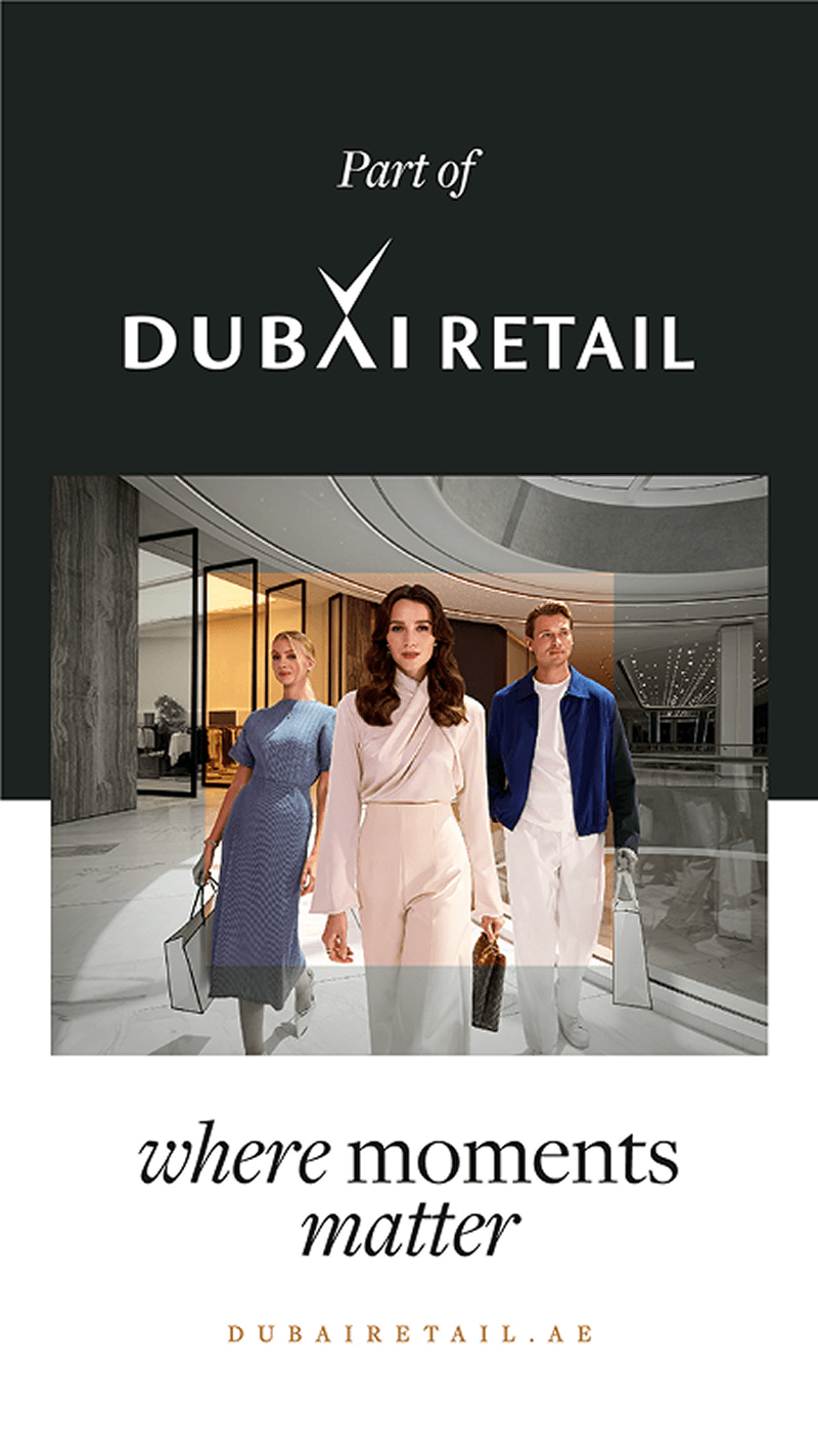 Three stylishly dressed people walking inside a modern retail space with Dubai Retail logo above and text 'where moments matter' below.
