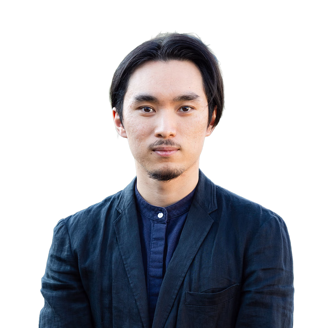 Portrait of a young man with short black hair and goatee wearing a dark blue shirt and jacket, looking straight at the camera.
