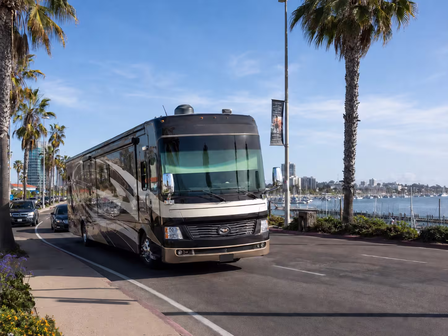 Luxury RV driving a coastal road in San Diego