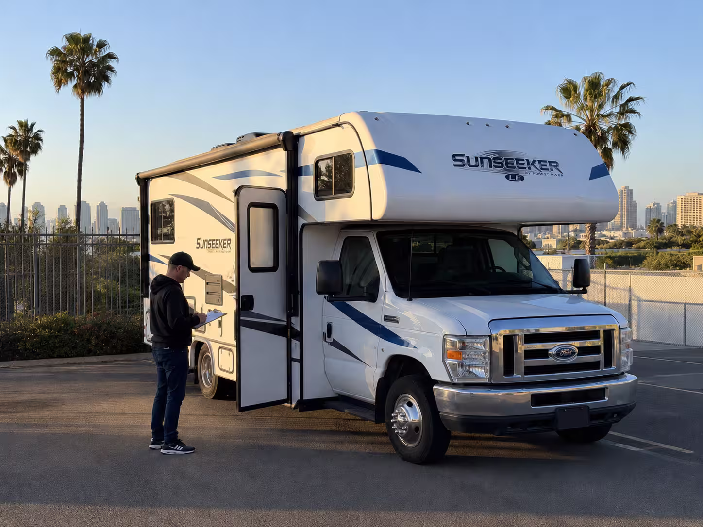 Renter reviewing Class C motorhome before San Diego pickup