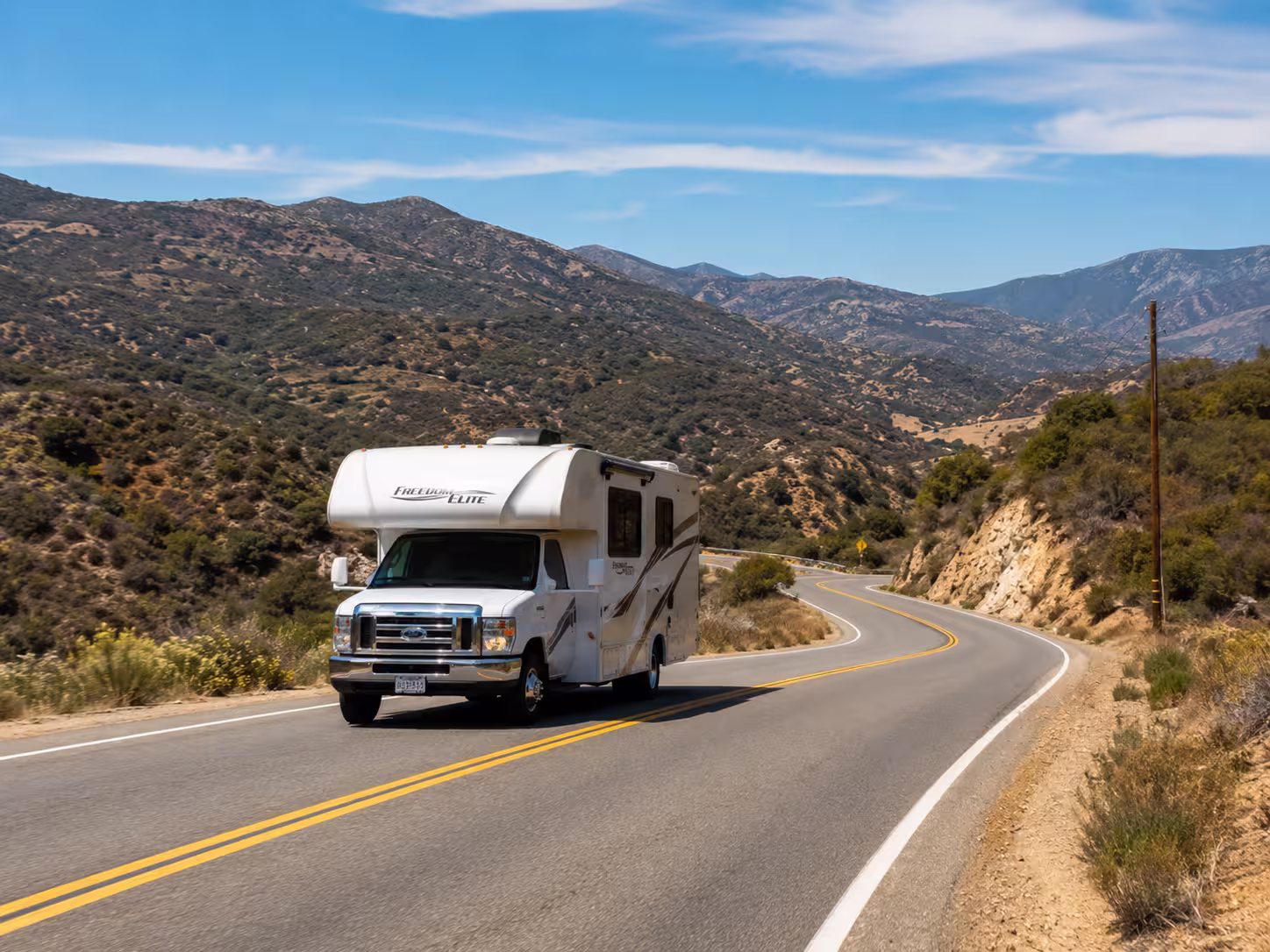 Small RV on an inland San Diego route