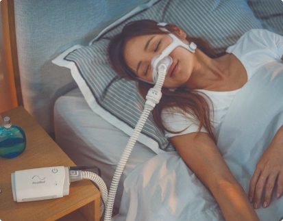 Woman sleeping in bad with cap mask on her face