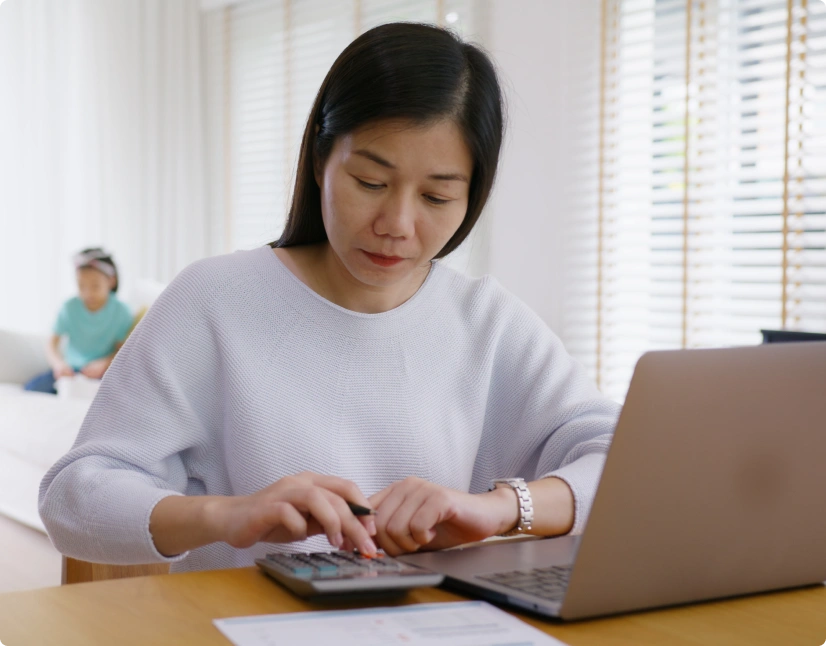 Woman with laptop and calculator