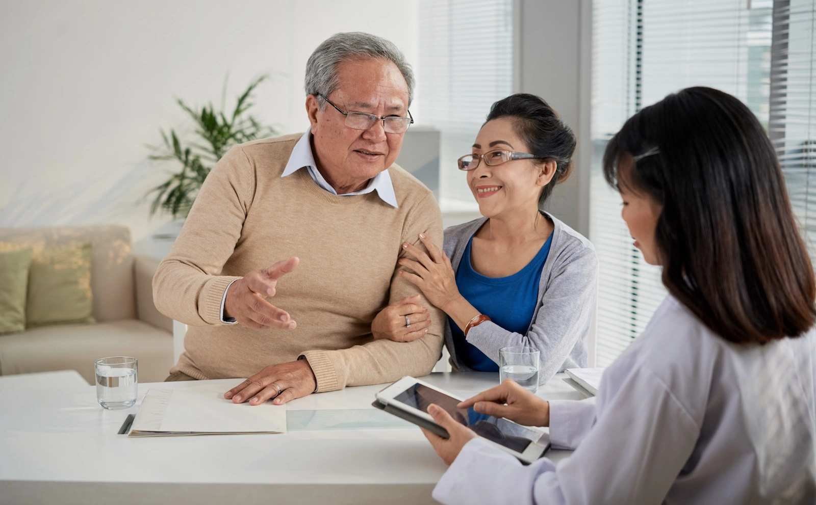 two elderly people, a woman and a man, at a medical consultation