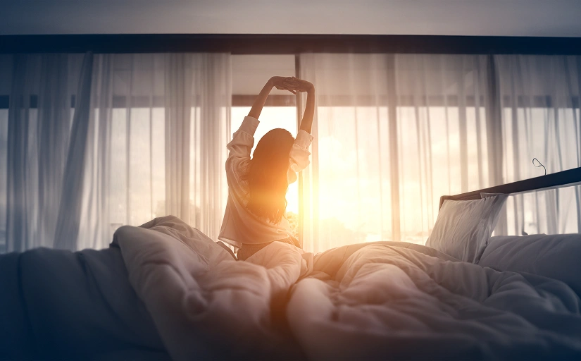 Woman in bead waking up