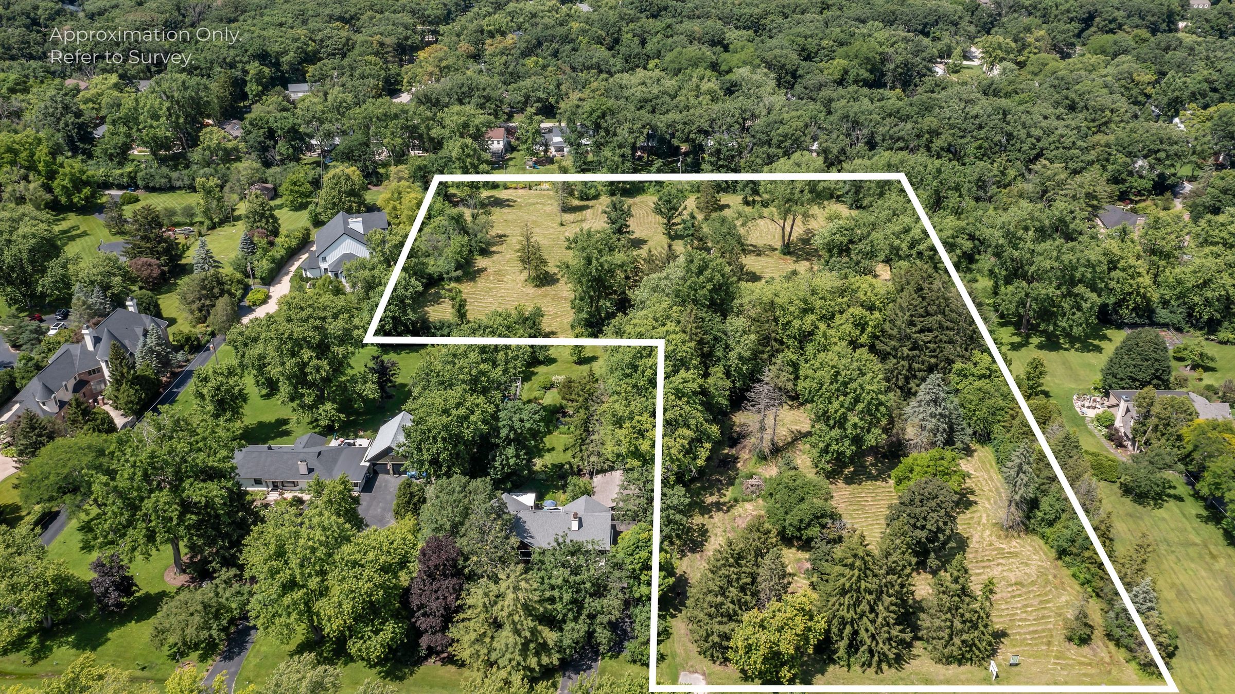 Aerial view of the 2950 Duffy Lane development in Riverwoods, Illinois with the property boundary outlined
