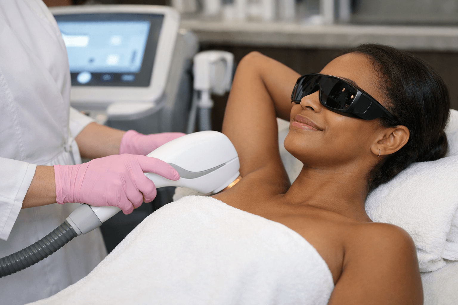 Laser hair removal treatment being performed on a client in Atlanta, Georgia clinic setting