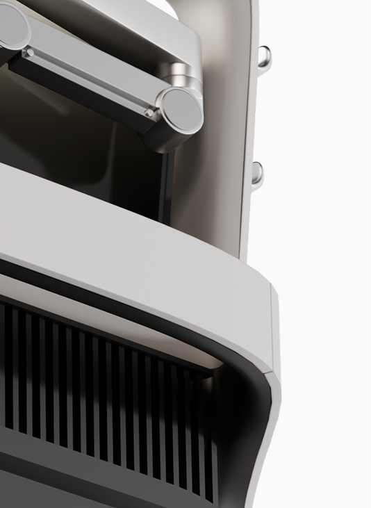 Close-up of a metallic robotic arm attached to a curved white and black industrial machine.