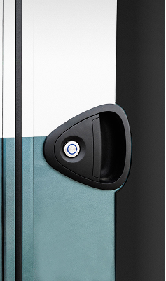 Close-up of a black triangular door handle with a round lock on a white and teal door.