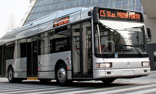 Silver city bus on a street with electronic signs showing route C5 Slaz. Prima Porta.