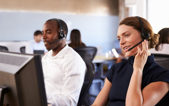 A picture of employees working in a customer support center