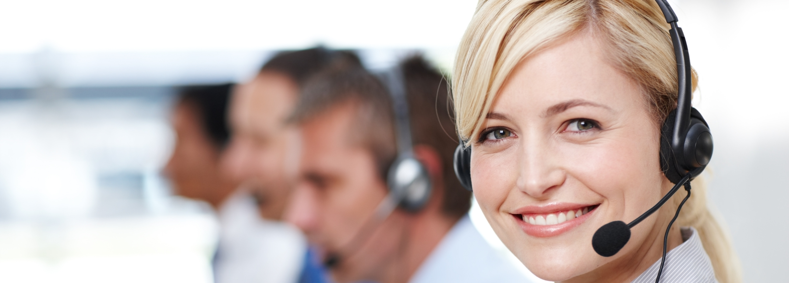 A picture of a customer support staff smiling at the camera