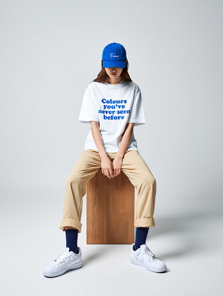 A woman sitting on top of a wooden block.
