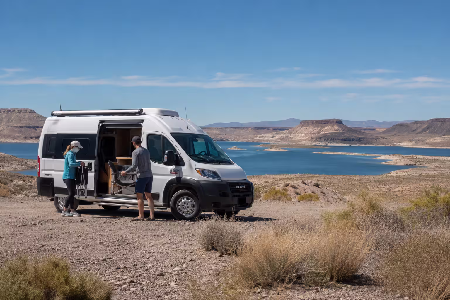 Class B camper van parked above Elephant Butte Lake in New Mexico