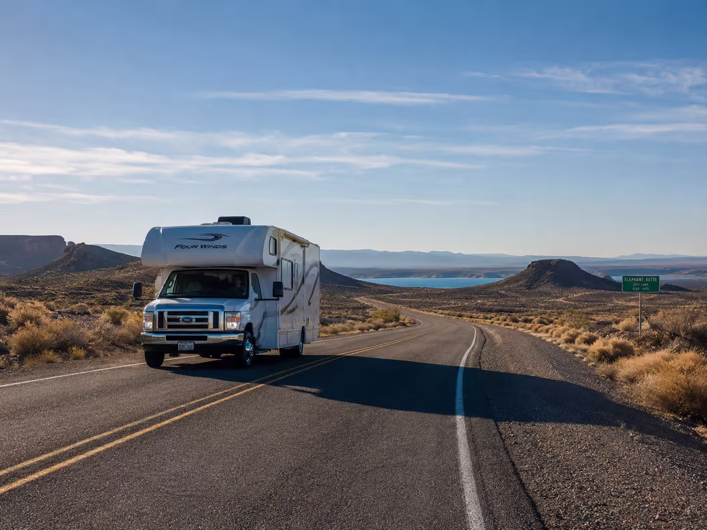 Class C motorhome driving toward Elephant Butte, New Mexico