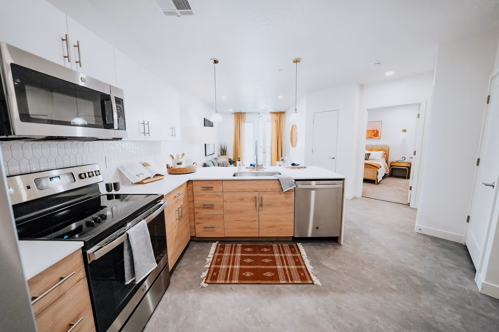kitchen with stainless steel appliances and view of furnished breakfast bar and living area