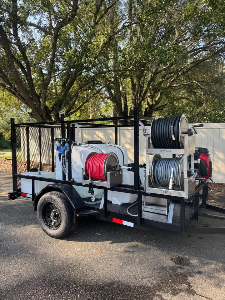 Dialed In Pro Cleaning commercial pressure washing rig with water tank, hose reel and commercial-grade equipment