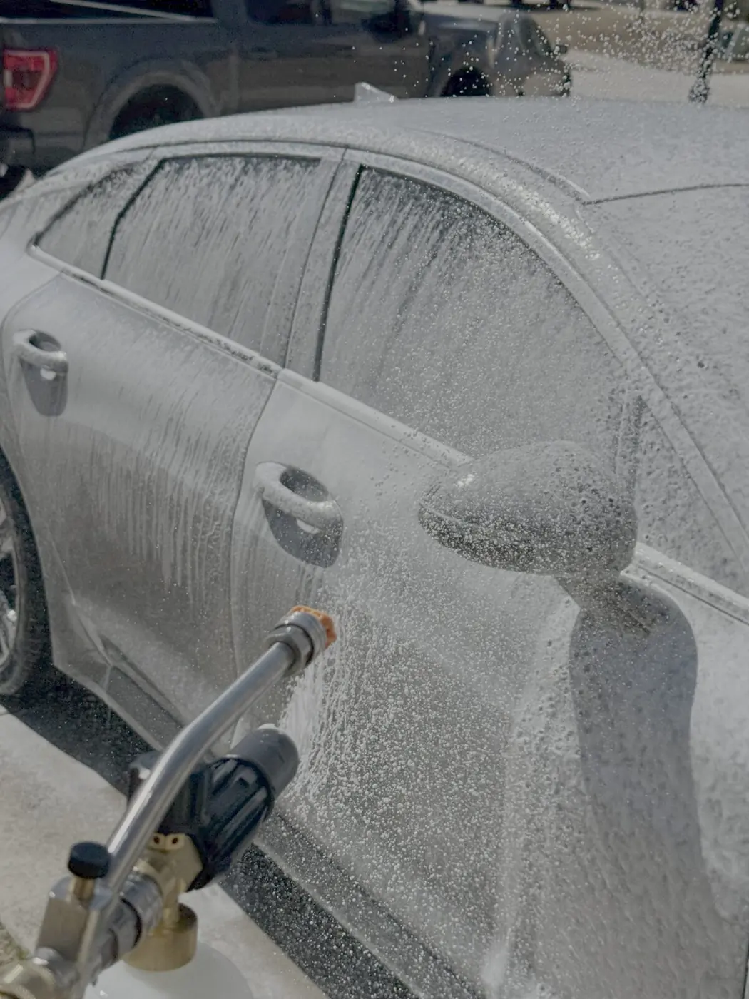 Foam wash on a sedan during a mobile detail