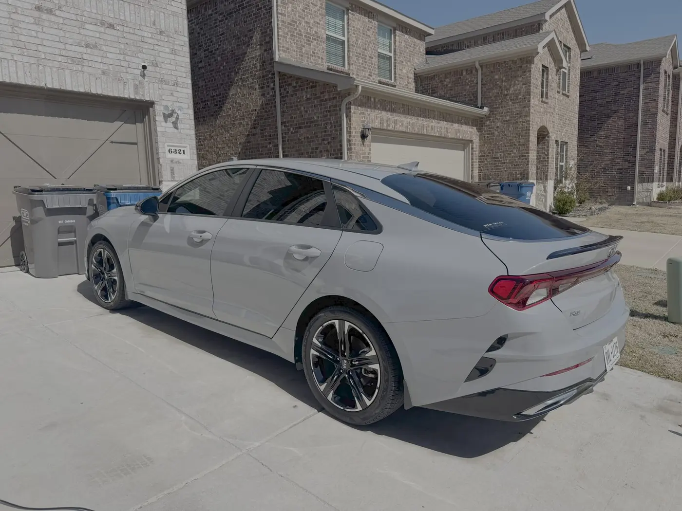 Mobile automotive detailing in progress on a customer driveway