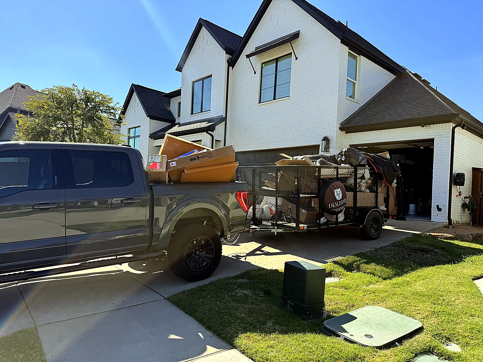 Dialed In Pro Cleaning truck and trailer on a junk removal job in the Dallas-Fort Worth metroplex