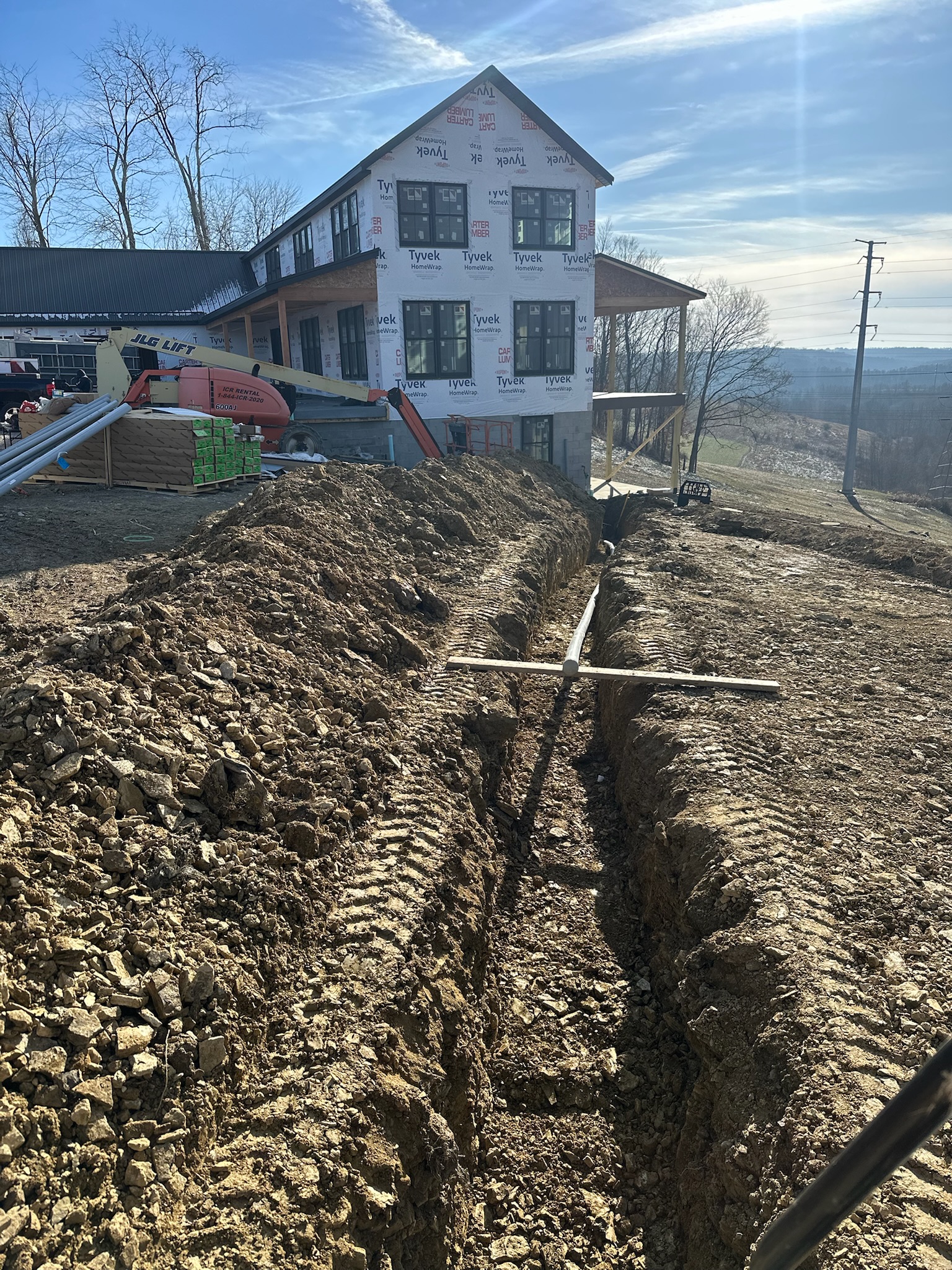 image of team in front of company building (for a roofing contractor)