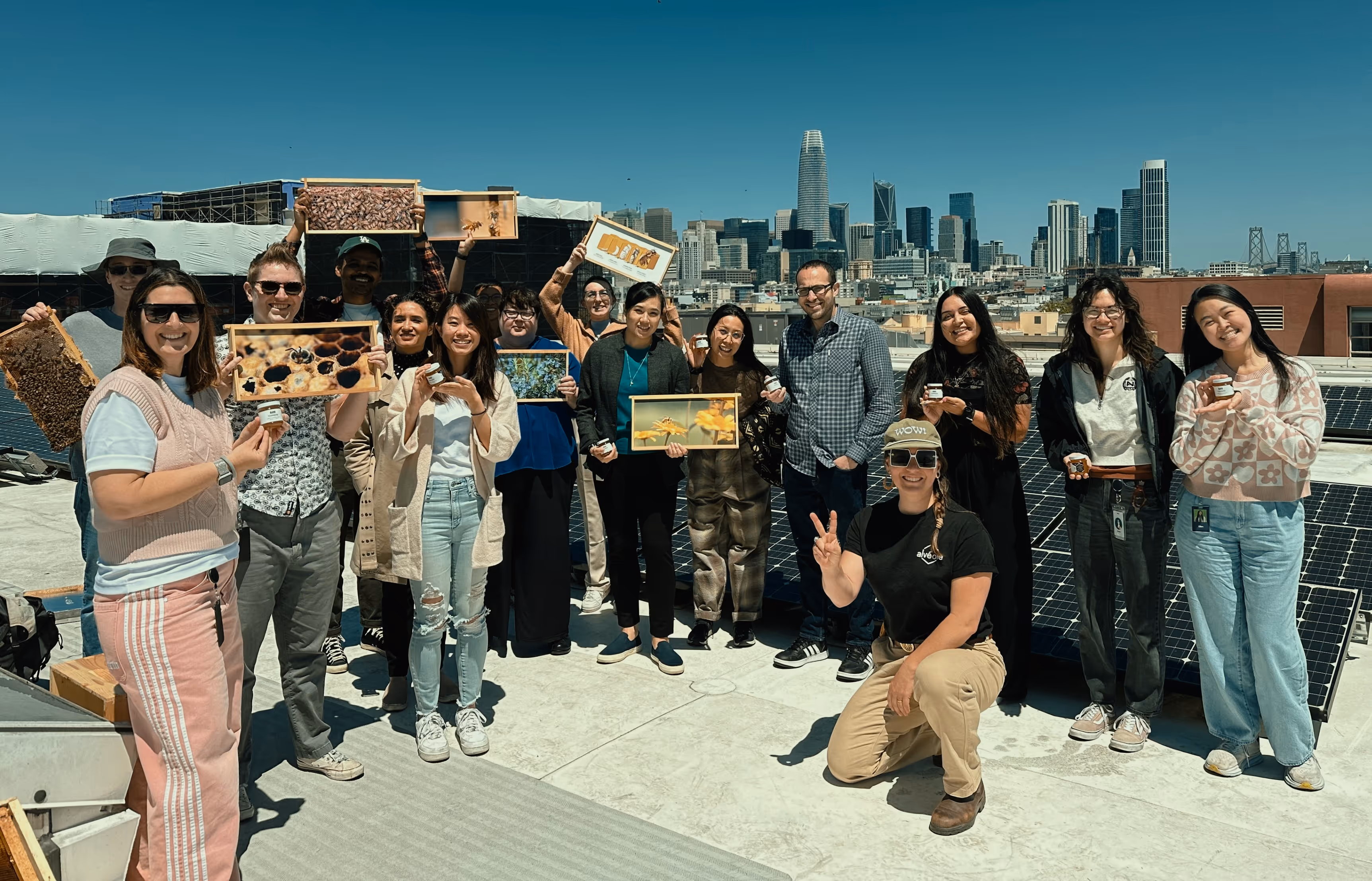 Alvéole beekeeping workshop event in San Francisco with participants gathered around an open hive