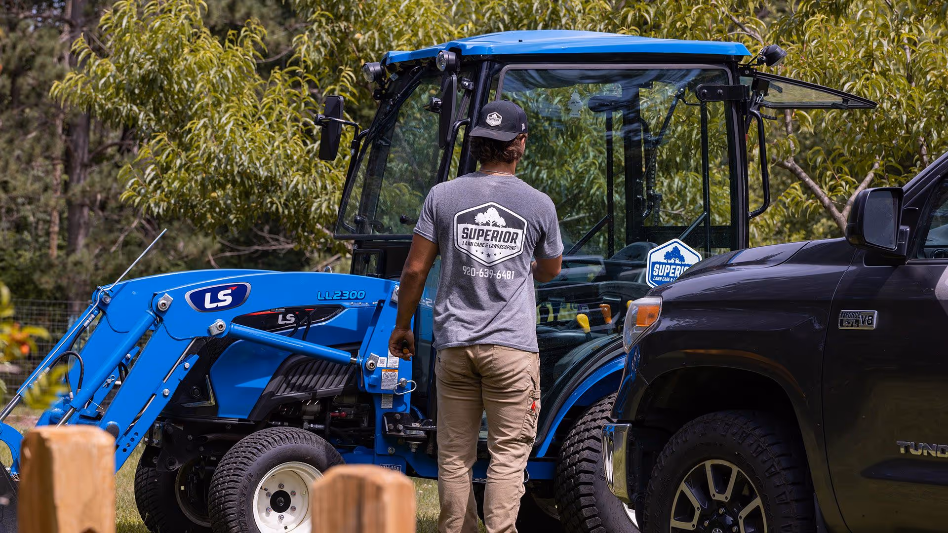 Landscaping team completing lawn maintenance for homes and businesses