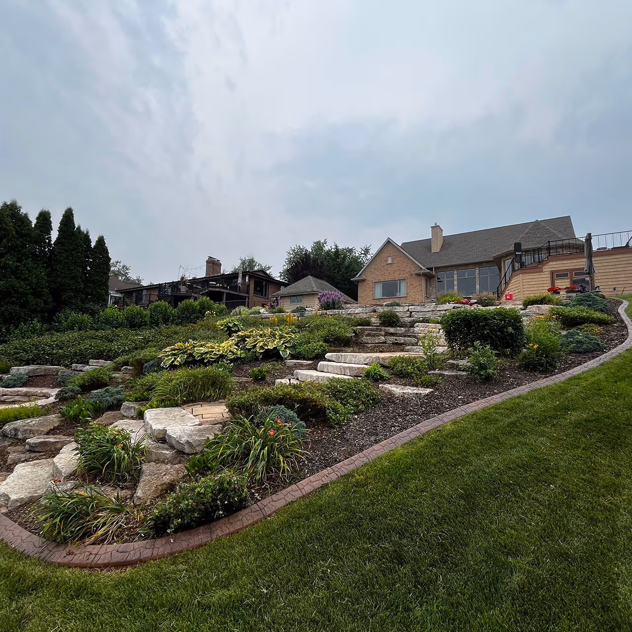 Decorative rock and mulch installation for residential landscaping