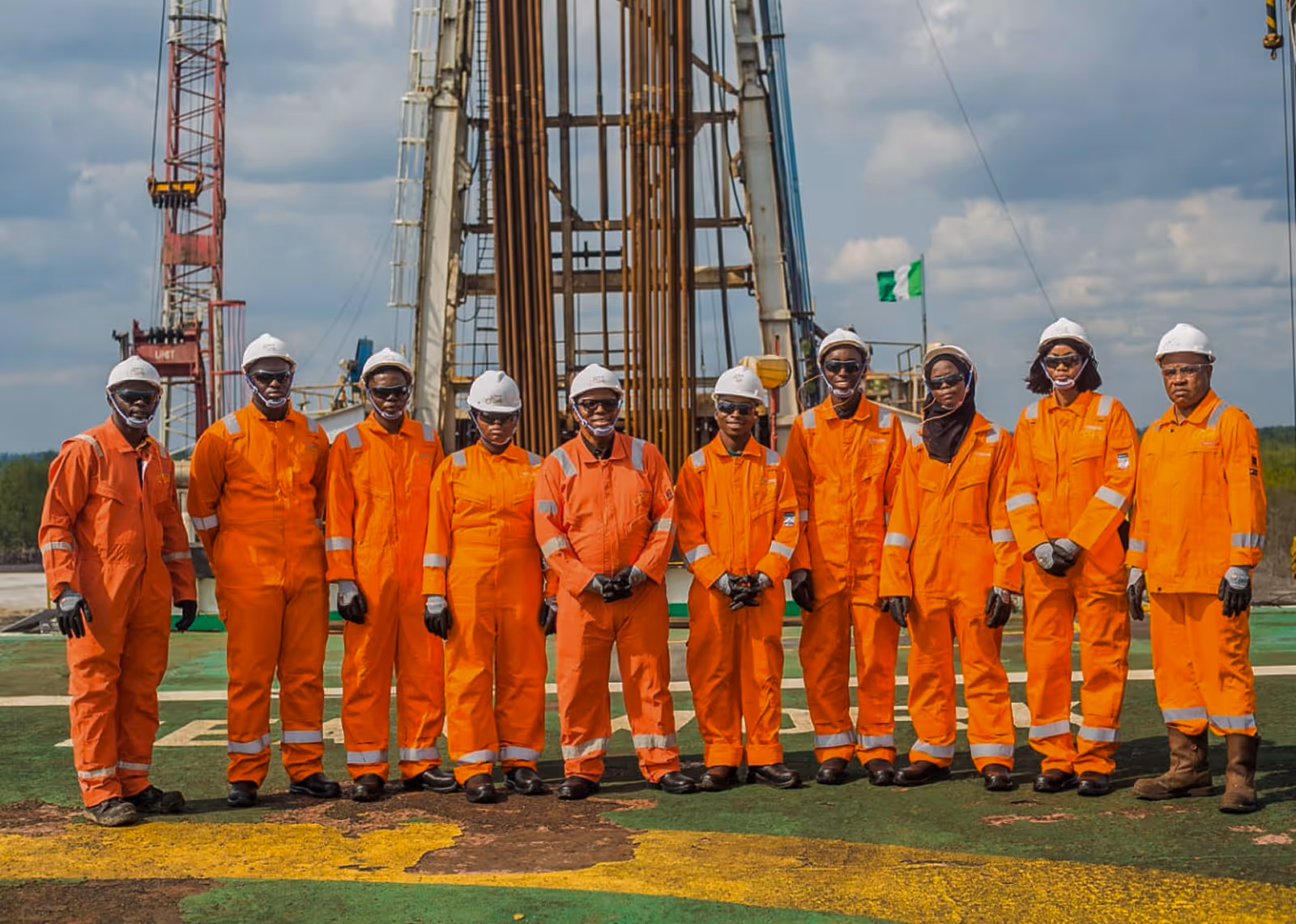 An image of an office desk showing an african man behind the desk