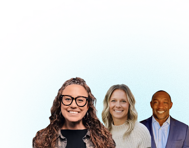 Three smiling people: a woman with long curly hair and glasses, a woman with blonde wavy hair in a light sweater, and a man in a blue suit and light shirt.