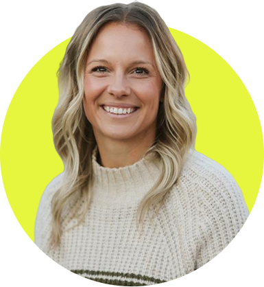 Smiling woman with wavy blonde hair wearing a light knitted sweater against a lime green circular background.