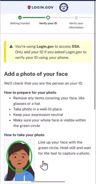 Login.gov verification screen instructing users to add a photo of their face for SSA access, with guidance to remove face-covering items, take the photo in a well-lit place, keep a neutral expression, and ensure the whole face fits within a green circle. A cartoon face illustration inside a green circle is shown with instructions to line up the face and hold still to capture the photo.