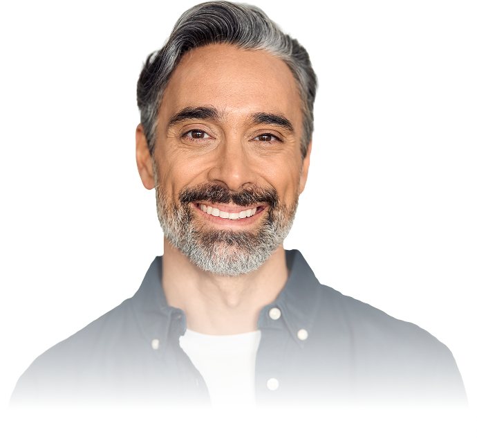 Smiling middle-aged man with gray hair and beard wearing a dark button-up shirt over a white t-shirt on a transparent white background.
