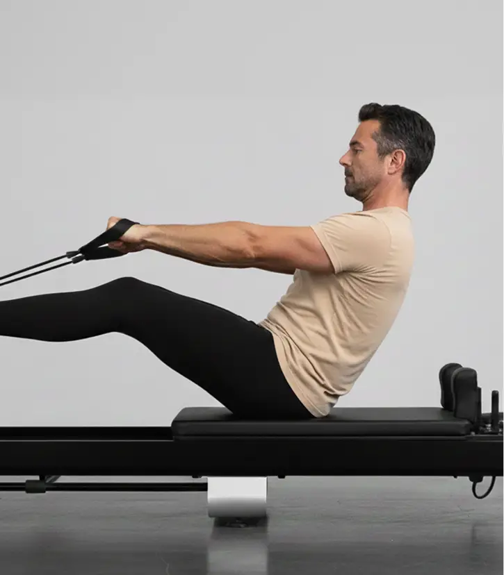 A man doing reformers pilates