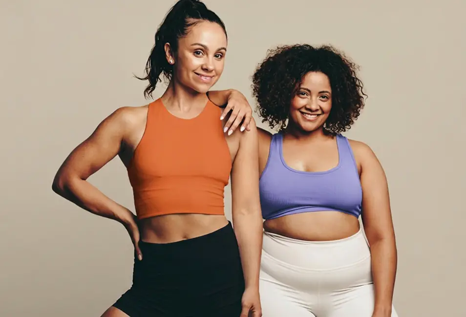 Two woman standing smiling