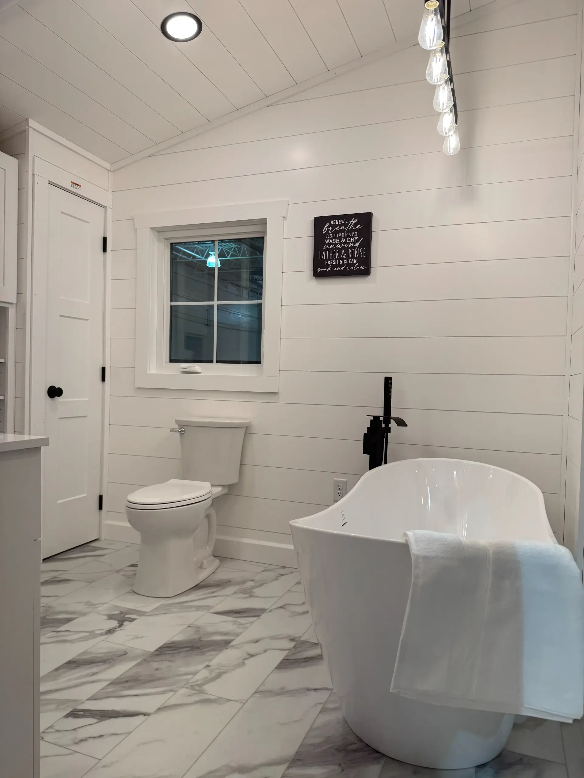 tiny home bathroom with bath tub