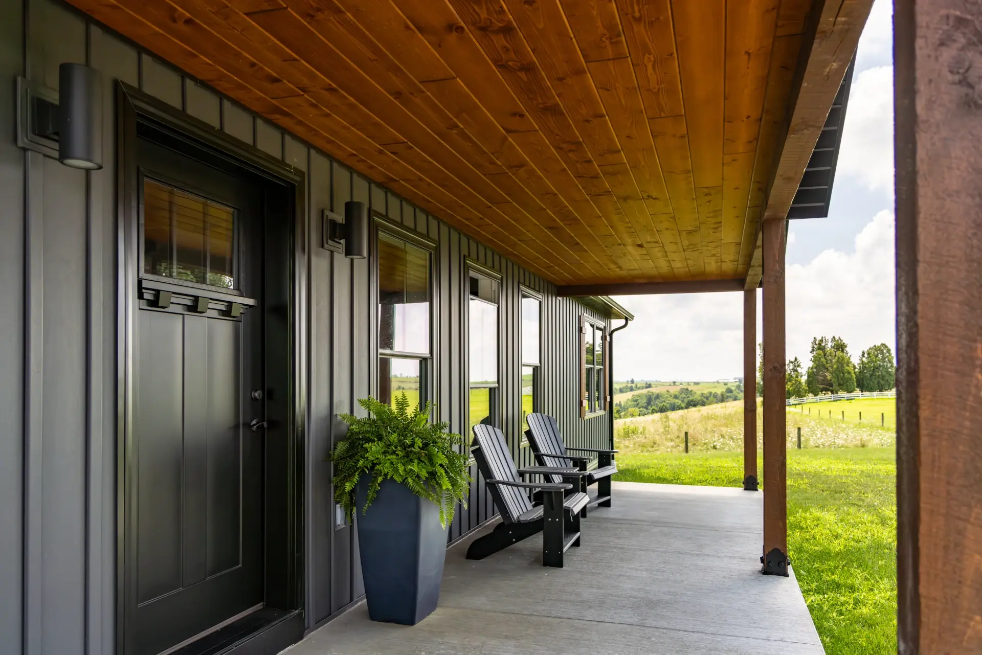 modular home front door with seating on front cement pad