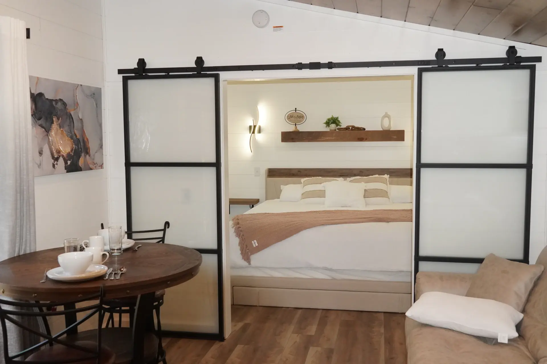 tiny home bedroom with open barn doors