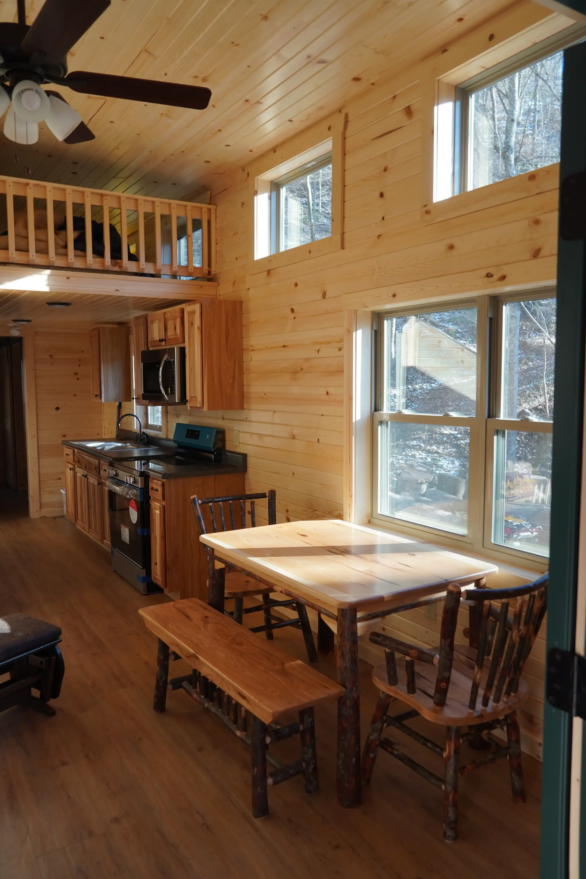 custom tiny home sitting area by kitchen