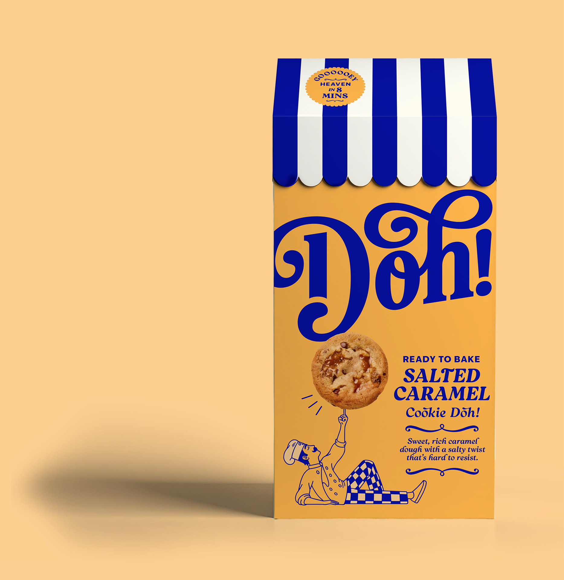 Box of Doh! ready-to-bake salted caramel cookie dough with blue and white striped top and illustration of a baker holding a cookie.